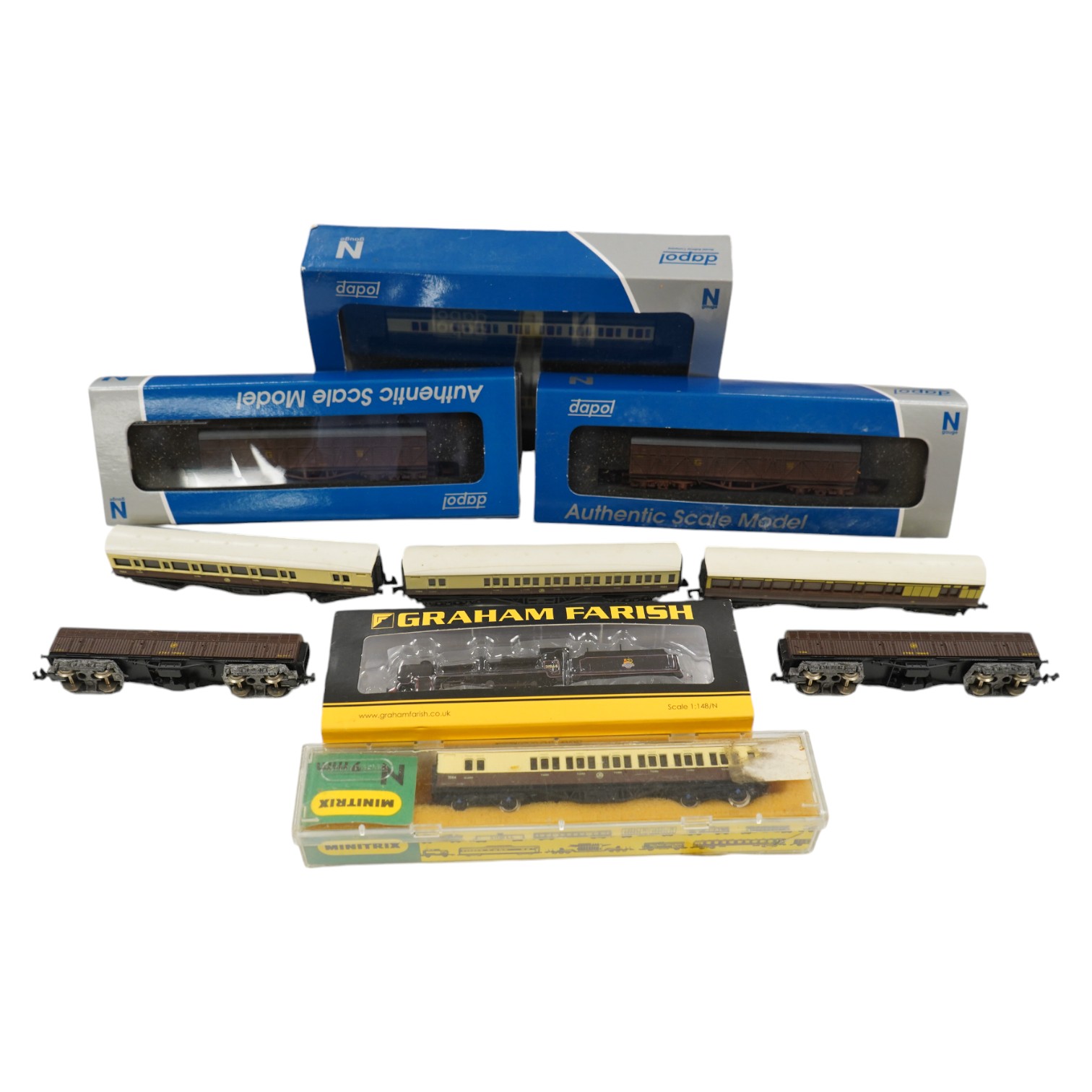 Eleven N gauge railway items by Dapol and Graham Farish; a BR N Class 2-6-0 locomotive, 31844, six GWR bogie coaches, two Siphon H wagons and two Siphon G wagons. Condition - good, five items boxed.